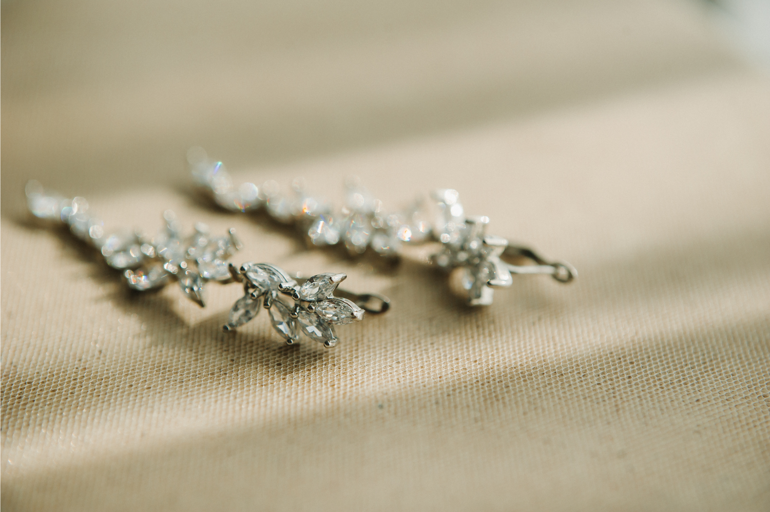 A pair of American Diamond earrings in a floral design.