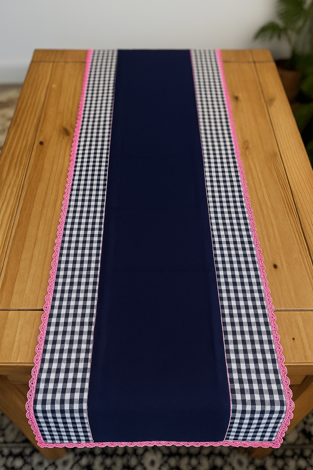 Nautical Bloom Handmade Table Runner with dark blue centre and checked border on a wooden table