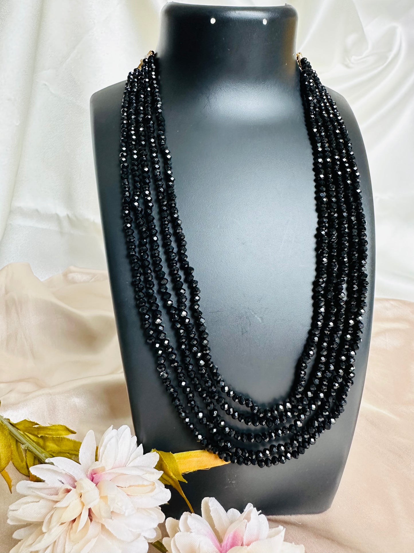Black coloured 5-Layer Crystal Beaded Handmade Necklace with length adjustable string at the back.