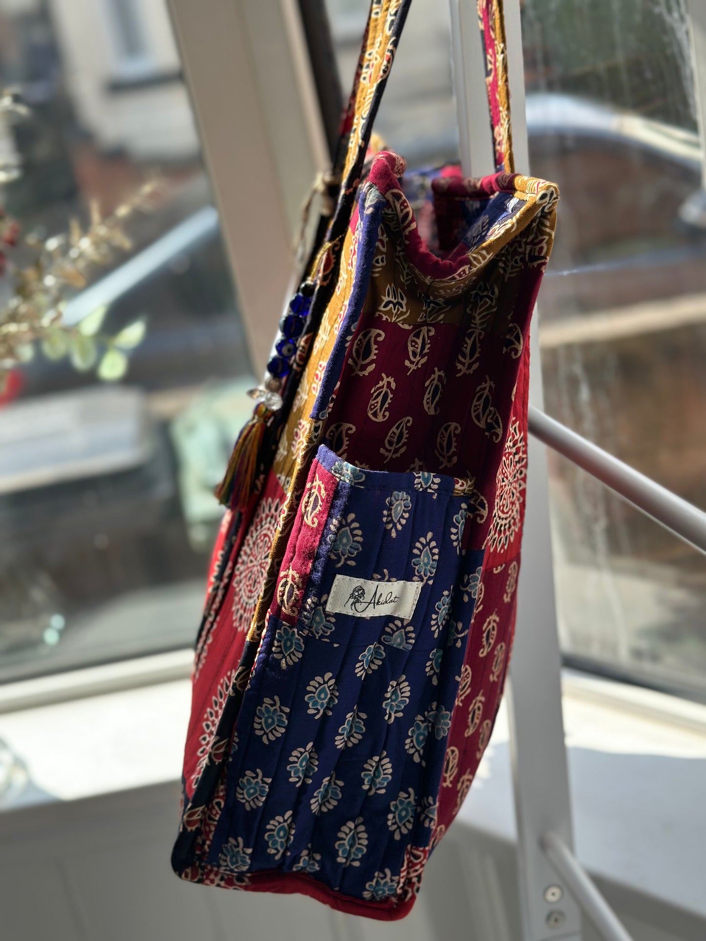 Sustainable boho tote bag with side water bottle compartment