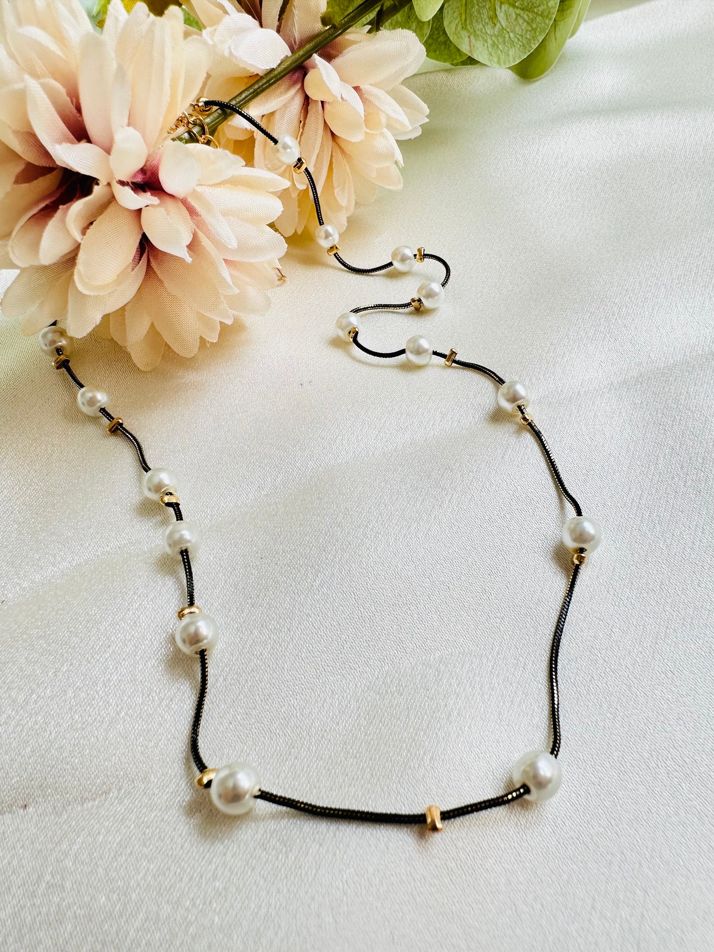 Black and gold coloured multi shaded chain Necklace with White coloured Pearl (Faux)  placed at equidistance. Elegant Statement Jewellery with adjustable hook and chain.