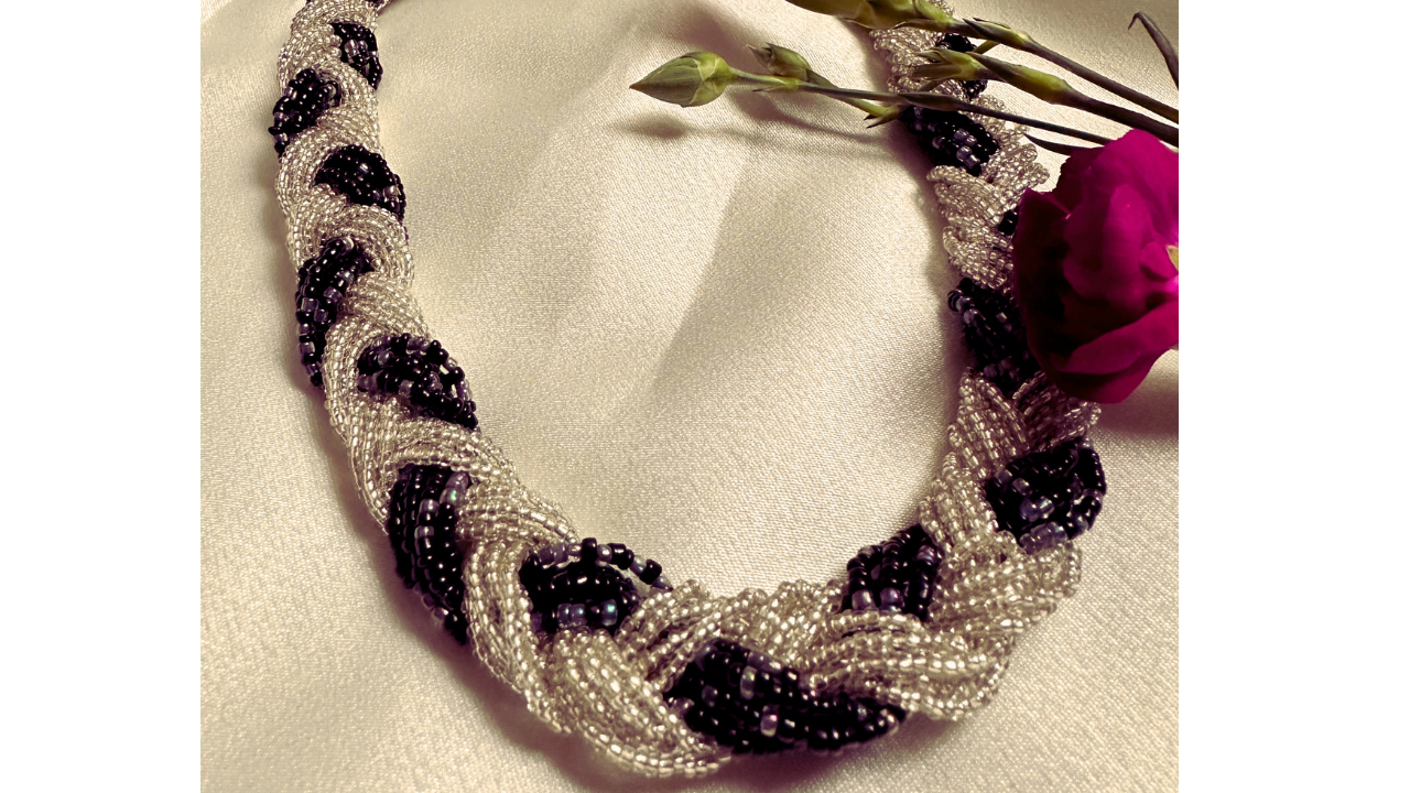 Braided Necklace with strands of different colours of beads braided together to create a statement necklace