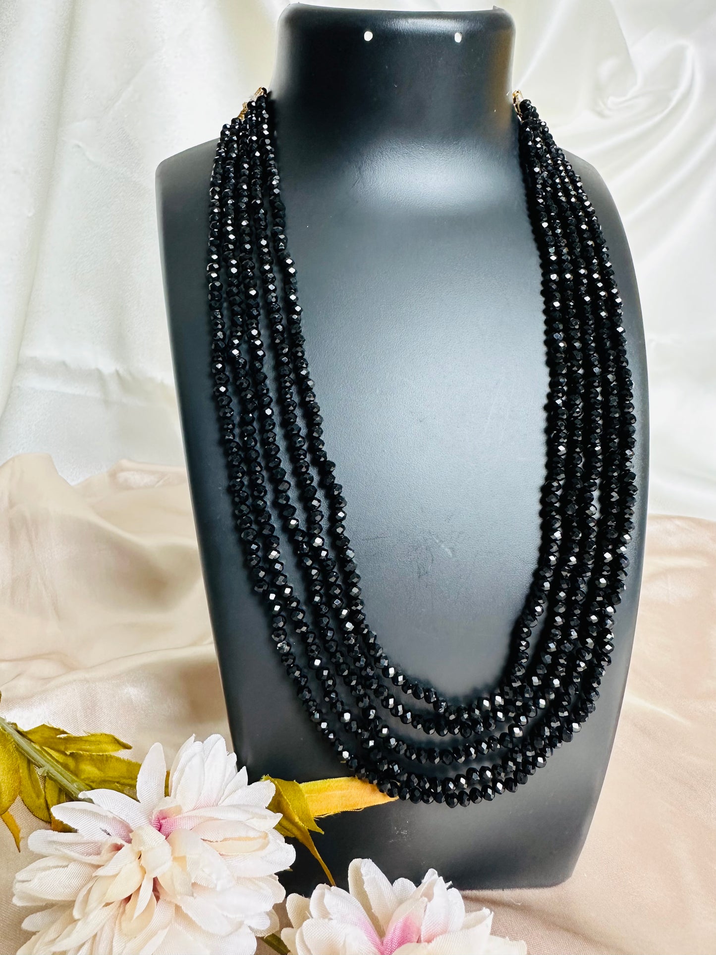 Black coloured 5-Layer Crystal Beaded Handmade Necklace with length adjustable string at the back. 