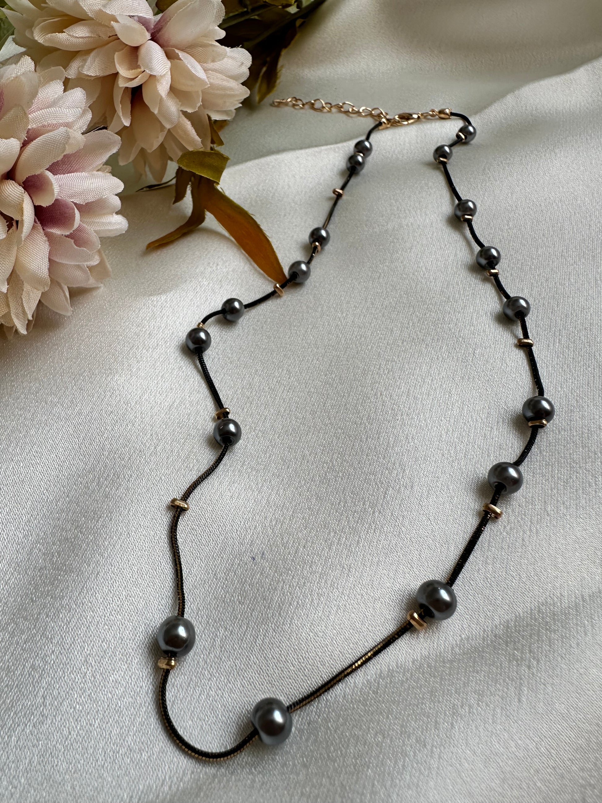 Black and gold coloured multi shaded chain Necklace with Grey coloured Pearl (Faux)  placed at equidistance. Elegant Statement Jewellery with adjustable hook and chain. 