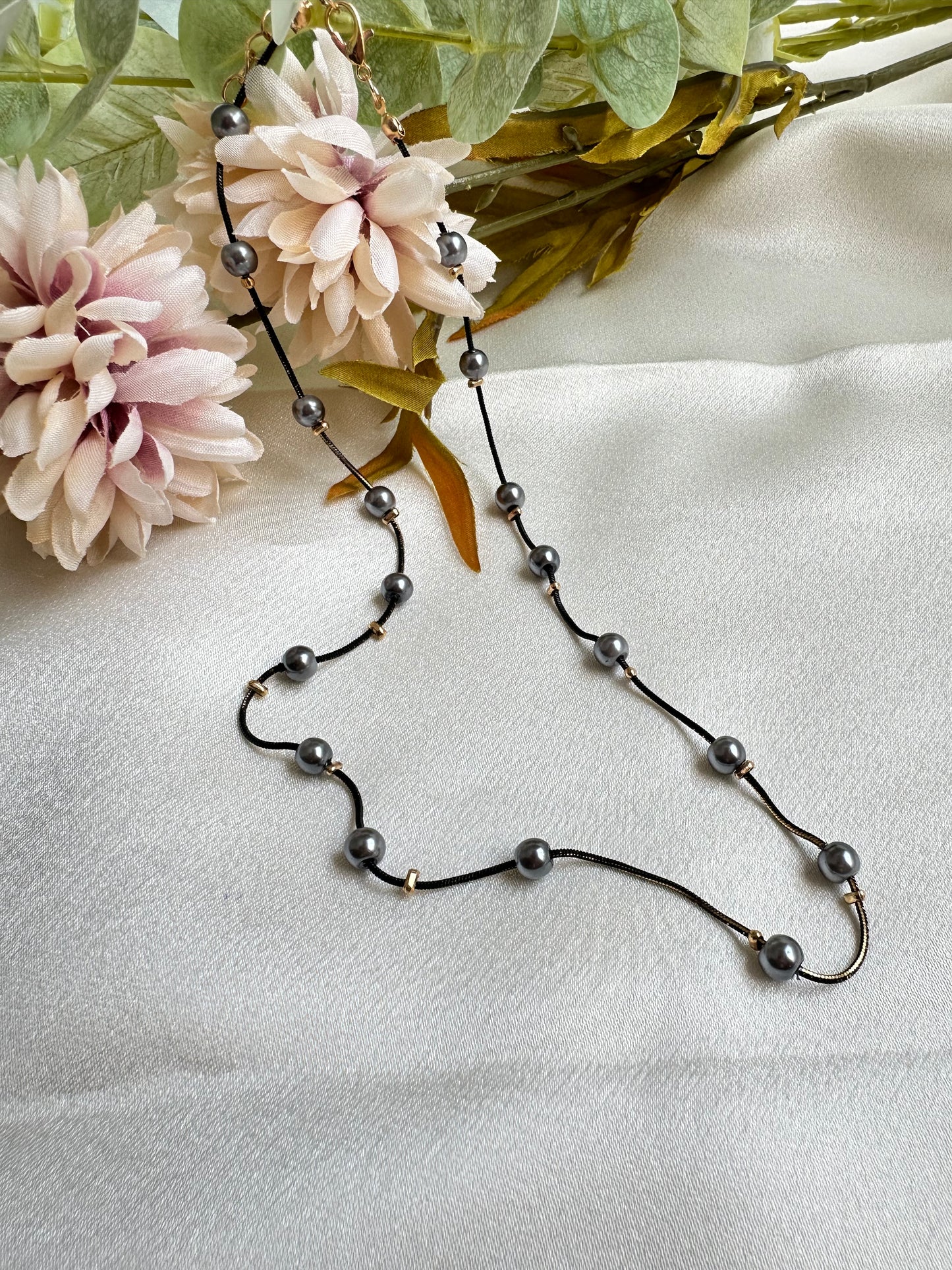 Black and gold coloured multi shaded chain Necklace with Grey coloured Pearl (Faux)  placed at equidistance. Elegant Statement Jewellery with adjustable hook and chain. 