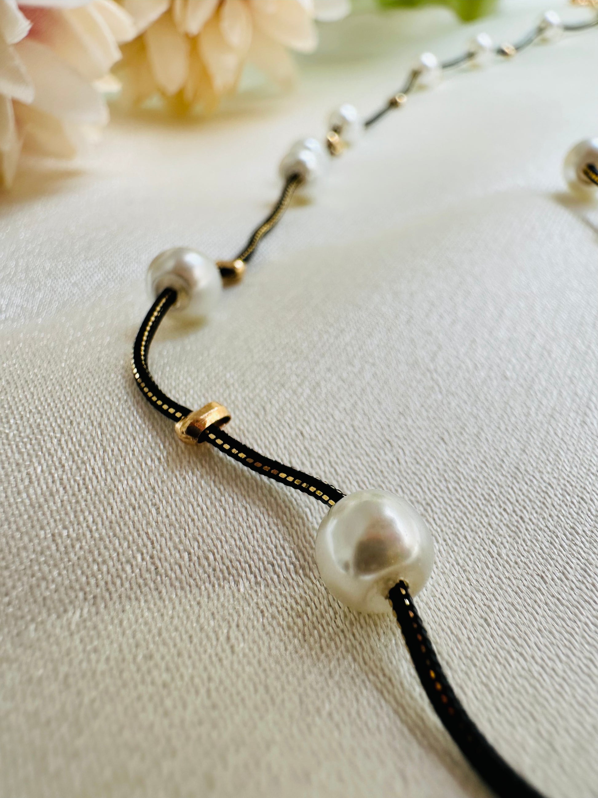 Black and gold coloured multi shaded chain Necklace with White coloured Pearl (Faux)  placed at equidistance. Elegant Statement Jewellery with adjustable hook and chain. 